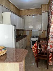 Kuchyň nebo kuchyňský kout v ubytování Sekhmet Appartement sur le roof