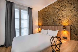 Postel nebo postele na pokoji v ubytování Hotel Daval