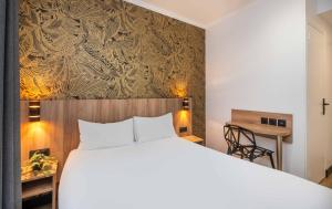 Postel nebo postele na pokoji v ubytování Hotel Daval