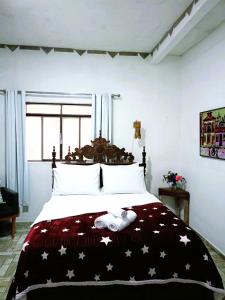 En eller flere senge i et værelse på Casa Bella Tiradentes