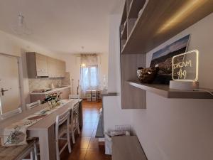 a kitchen with a large island in a room at Le Floreali - Casa Rosmarino in Bolsena
