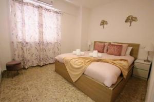 Łóżko lub łóżka w pokoju w obiekcie TESS Apartamento Don Miguel