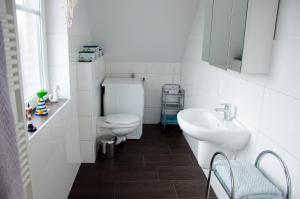 Koupelna v ubytování Ferienhaus Frische Brise + 4 fotografie