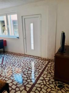 TV a/nebo společenská místnost v ubytování Nina Apartments