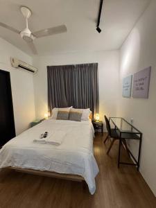 a bedroom with a bed and a glass table at Rumakita #4 Vista Alam Top Floor Studio in Shah Alam