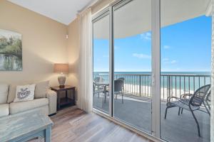 a living room with a couch and a view of the ocean at Spanish Key Unit 602 in Pensacola