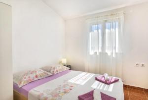 Posteľ alebo postele v izbe v ubytovaní Apartments Jera