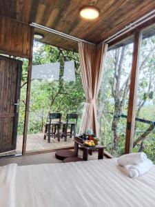 Postel nebo postele na pokoji v ubytování Mimoza homestay, Cầu Đất - Đà Lạt