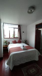 Postel nebo postele na pokoji v ubytování Hotel Kuelap Chachapoyas