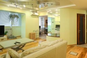 a living room with a couch and a table at Квартира по улице Большая Васильковская, 129 in Kyiv