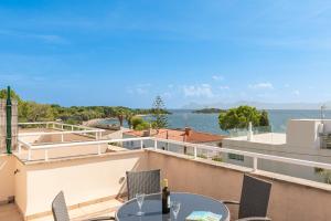 a view of the water from the balcony of a house at Beach Villa Arran de Mar by Sealand Villas in Alcudia