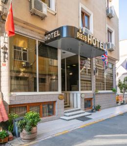 a hotel building with a sign that reads hotel fees hotel at Grand Reis Hotel in Istanbul