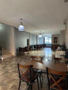 a large room with tables and chairs in a building at Herton Boutique Hotel in Istanbul