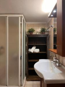 a bathroom with a shower and a sink and a sink at Carlito apartment 1 next to metro station in Athens