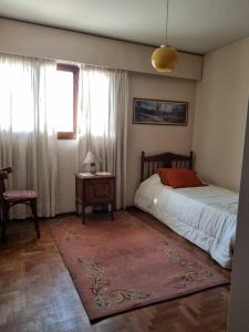 Ένα ή περισσότερα κρεβάτια σε δωμάτιο στο Casa familiar céntrica
