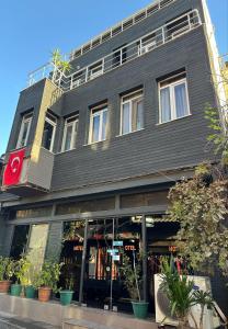 a large black building with windows and plants at Herton Boutique Hotel in Istanbul