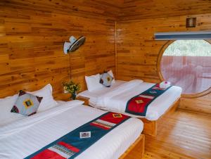 Postel nebo postele na pokoji v ubytování H'Mong Cát Cát Homestay