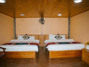 Postel nebo postele na pokoji v ubytování H'Mong Cát Cát Homestay