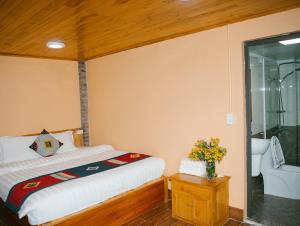 Postel nebo postele na pokoji v ubytování H'Mong Cát Cát Homestay