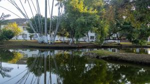 a reflection of a building in a body of water at Nobile Hotel Belém in Belém +8 photos