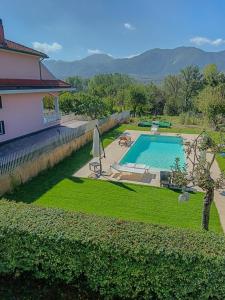 a house with a swimming pool in a yard at Casa Fiorella - Irpinia in Lioni