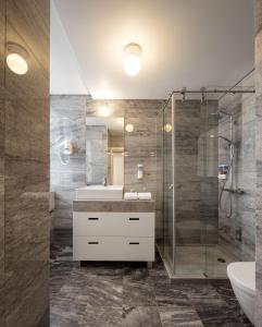 a bathroom with a sink and a shower at Lisbon Serviced Apartments - Baixa Castelo in Lisbon