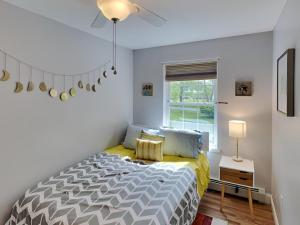 a bedroom with a bed and a window at Saco Sanctuary in Saco