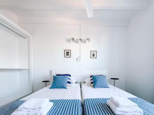 Postel nebo postele na pokoji v ubytování Hostal SA Roqueta Mahon