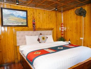 Postel nebo postele na pokoji v ubytování H'Mong Cát Cát Homestay