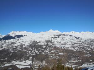 a mountain covered in snow with a town on it at Appt cosy 5 pers à La Plagne, proche pistes, animaux admis - FR-1-353-57 in La Plagne