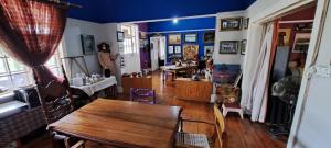 a room with a wooden table and a dining room at Purple House B&B Smithfield in Smithfield