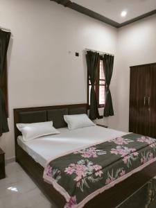 Postel nebo postele na pokoji v ubytování Blue Bell Homestay