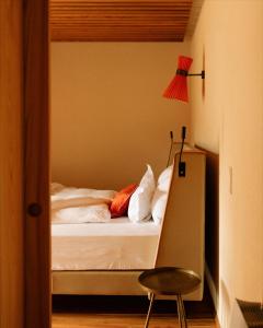 Postel nebo postele na pokoji v ubytování Langenmantel Historic Suites
