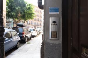a parking meter on the side of a building at Il Sipario Luxury Apartments in Palermo
