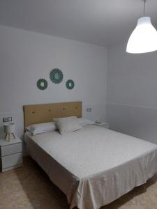 Ένα ή περισσότερα κρεβάτια σε δωμάτιο στο Mi casita en Tias