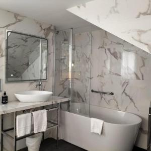 Kúpeľňa v ubytovaní Hotel Clopy Rocamar