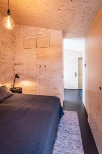 Postel nebo postele na pokoji v ubytování Aska, Modern Cabin