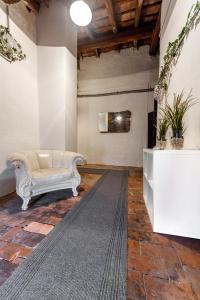 a living room with a couch and a rug at Attic floor venice apartment in Mestre