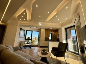 a living room with a couch and a table at Maria Luxury Apartment in Skopje