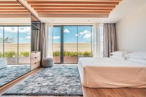 Postel nebo postele na pokoji v ubytování Probar Suites Punta Cana