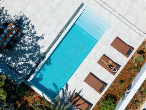 an overhead view of a swimming pool in a building at Nuera Villas in Chania +176 photos