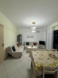 a living room with a couch and a table at Matleo appartament in Golem