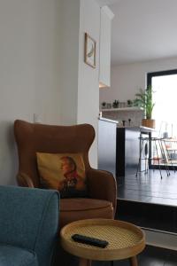 a living room with a couch and a table at Stunning Walthamstow Village Flat in London +18 photos