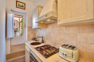 Kuchyň nebo kuchyňský kout v ubytování Cozy flat in downtown Orbetello + 8 fotografií