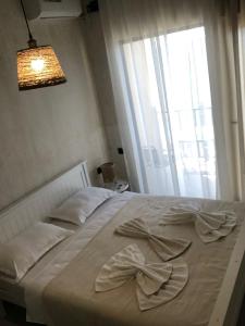 Postel nebo postele na pokoji v ubytování Grigoleti Dream House