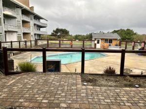 a fence around a swimming pool in a building at Grey Gull in Ocean Shores