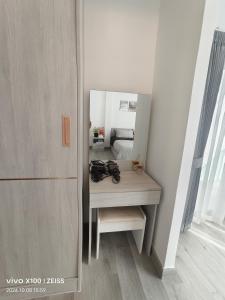 a dressing table in a room with a mirror at BB Vila, Chokchai village9 in Nong Prue