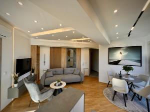 a living room with a couch and a table at Maria Luxury Apartment in Skopje