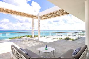 a house on the beach with a view of the ocean at Villa Skyline 5 Bedroom stunning Ocean View in Providenciales