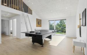 an office with a ping pong table in a room at Awesome Home In Ebeltoft With Sauna in Ebeltoft +23 photos